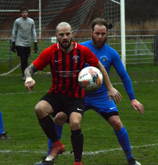 Nathan Greene shields the ball for Goodwick United